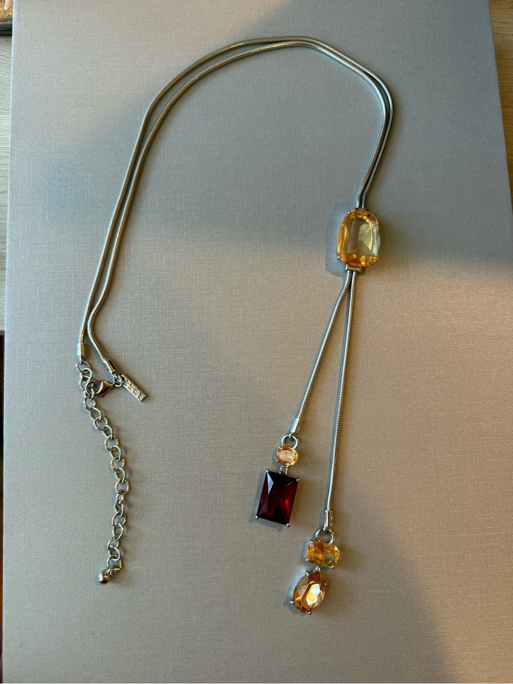 White House Black Market Lariat Necklace with Red and Topaz-colored Stones
